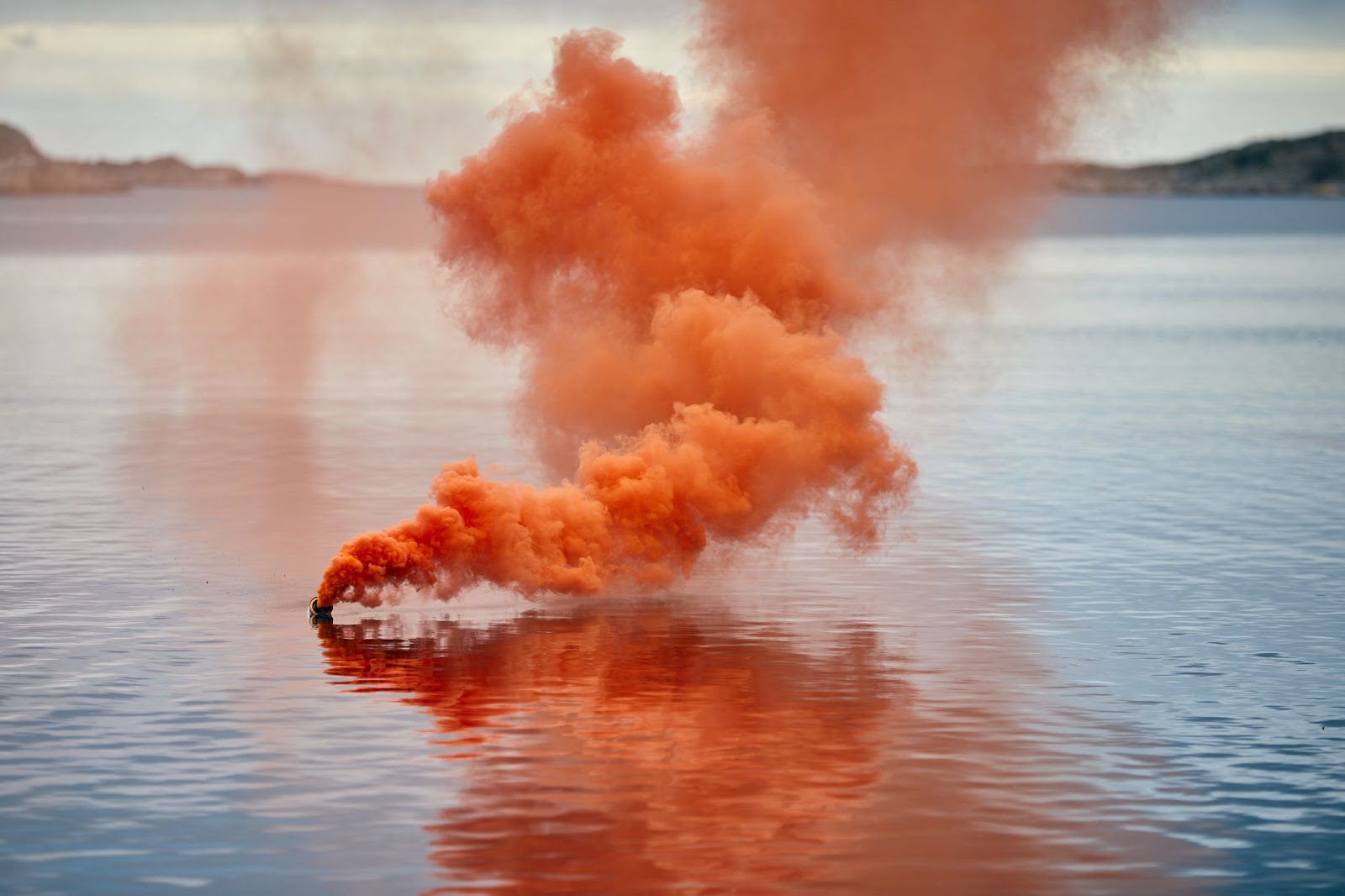 Buoyant Smoke Signals emitting orange smoke